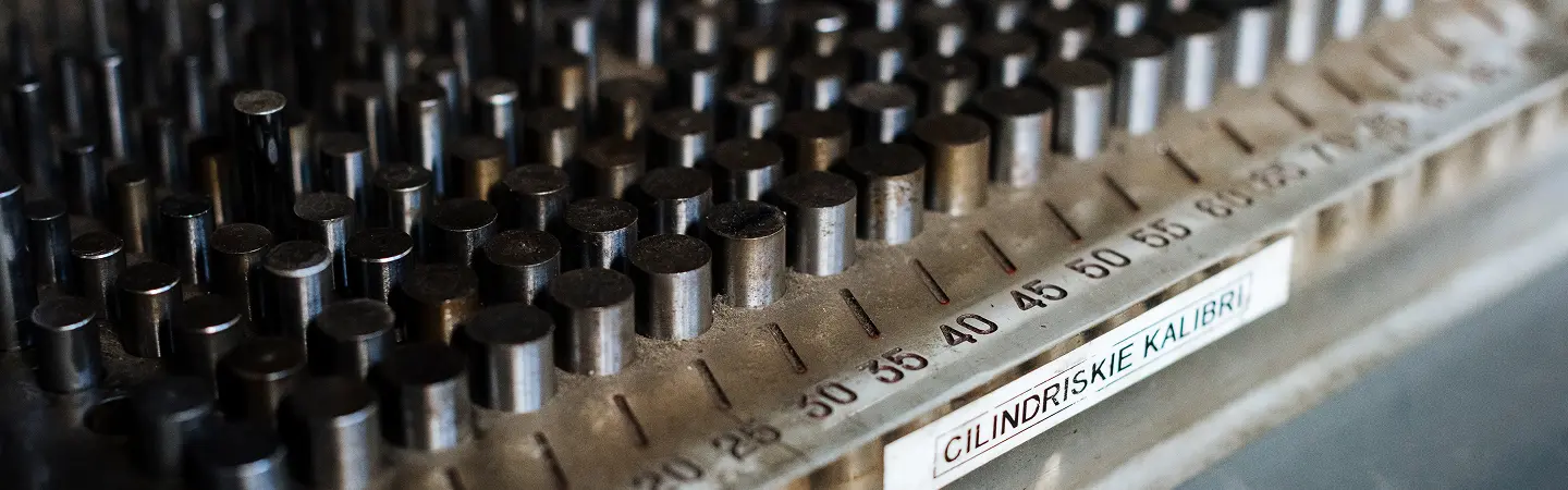 Precision cylindrical gauge blocks for CNC machining calibration, demonstrating meticulous measurement tools used in advanced manufacturing tolerancing