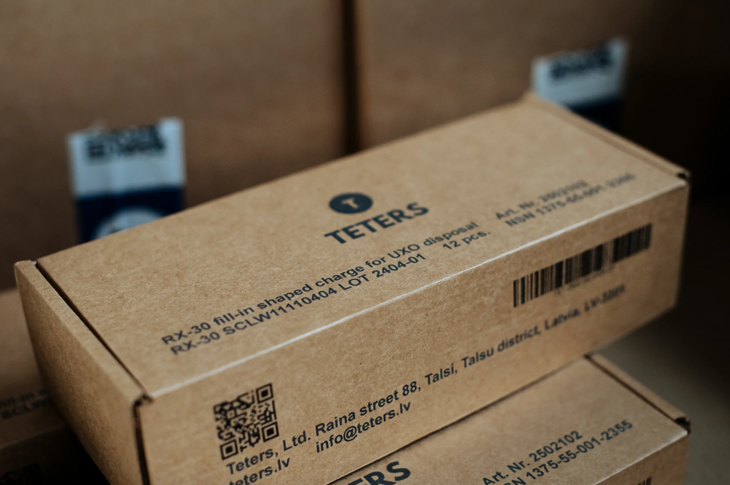 Cardboard shipping box with printed product details and barcode, prepared for professional assembly and packing operations by Teters Ltd.