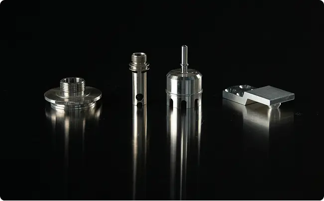 Set of precision-machined components showcasing threading, boring, and contouring made by Teters with CNC Turning & Milling