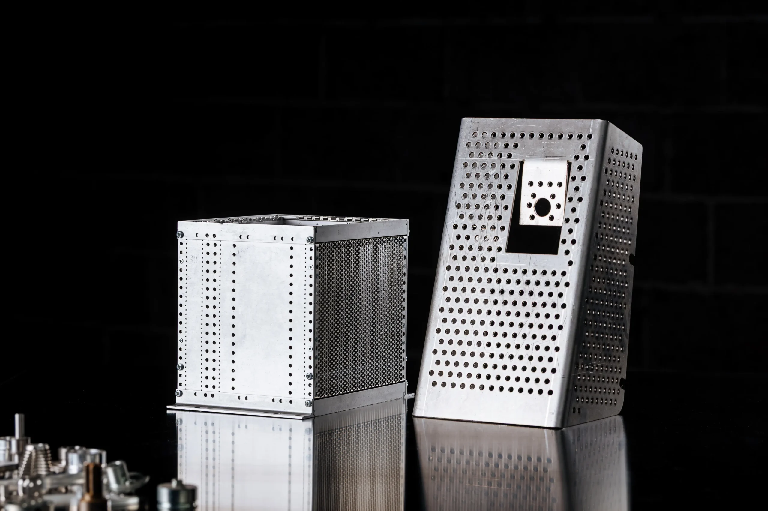 Laser-cut sheet metal with precision holes and folded edges