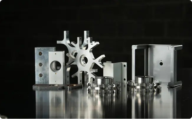 Custom CNC Turning & Milling parts including brackets, housings, and gear-like components manufactured by Teters