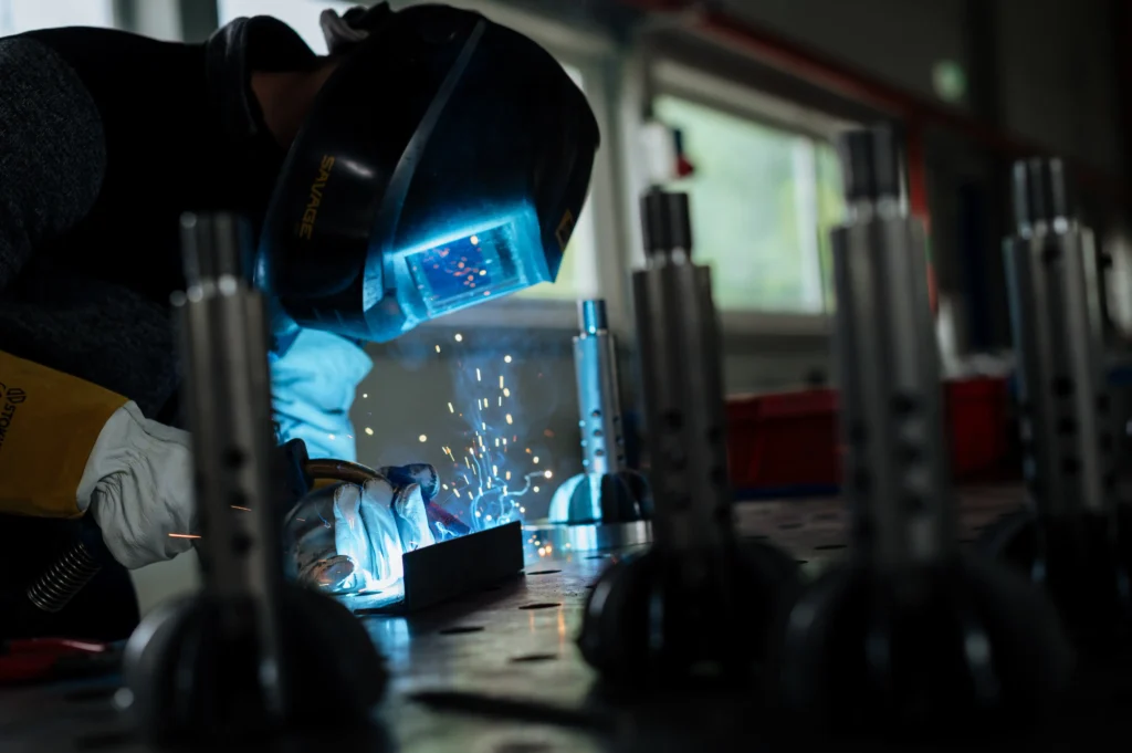 Technician performing precision TIG welding in a workshop — part of our professional welding services for high-quality metal fabrication.